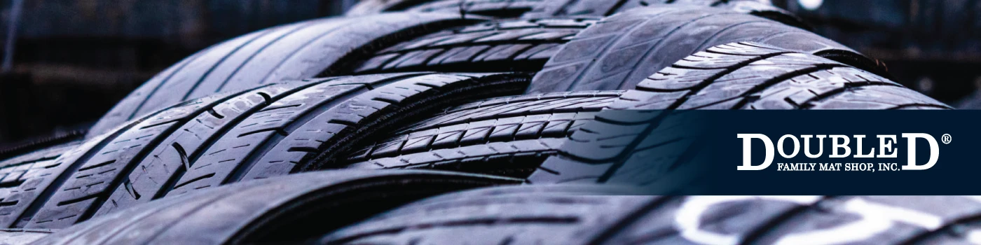 Banner image of Double D Mat Shop logo overlaid over tires by Custer Creative